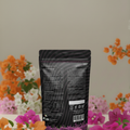 Bougainvillea feed 250gm packet back view with flowers